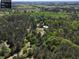 Aerial view of property outline showing house and building site, mature trees, and plenty of privacy at 5618 Highway 212, Covington, GA 30016