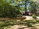 Lush backyard with mature trees and privacy at 5618 Highway 212, Covington, GA 30016