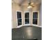 Bright breakfast nook featuring three large windows and a ceiling fan at 5618 Highway 212, Covington, GA 30016