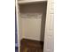 A closet featuring hardwood floors, white walls, and a metal clothing rack at 5618 Highway 212, Covington, GA 30016