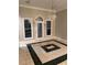 Elegant dining area featuring decorative tiled floors, chandelier, and natural light at 5618 Highway 212, Covington, GA 30016