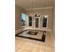 Spacious dining area featuring decorative tiled floors and hanging light fixture at 5618 Highway 212, Covington, GA 30016