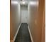 Hallway with tiled floor leading to a white front door at 5618 Highway 212, Covington, GA 30016