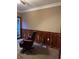 Home office featuring wooden wainscoting and leather office chair at 5618 Highway 212, Covington, GA 30016