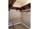 Walk-in closet featuring wooden shelves and metal racks at 5618 Highway 212, Covington, GA 30016