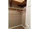 Walk-in closet with wood and wire shelving units at 5618 Highway 212, Covington, GA 30016