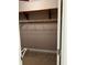 Walk-in closet with wooden shelves at 5618 Highway 212, Covington, GA 30016