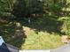 Expansive yard featuring a chicken coop with mature trees in a serene setting at 5618 Highway 212, Covington, GA 30016