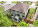 An aerial view of a home featuring a patio, a deck, landscaping and a shingled roof at 1645 Horseshoe Creek Ln, Cumming, GA 30041