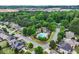 Aerial view showcasing lush landscaping and community pool in this neighborhood at 1645 Horseshoe Creek Ln, Cumming, GA 30041