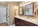 Bathroom featuring double sinks with granite countertops, vanity, and modern fixtures and finishes at 1645 Horseshoe Creek Ln, Cumming, GA 30041