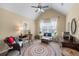 Charming bedroom with large rug, accent furniture, and natural light at 1645 Horseshoe Creek Ln, Cumming, GA 30041