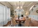Formal dining room with elegant lighting, decorative wall trim, and hardwood floors perfect for entertaining guests and Gathering dinners at 1645 Horseshoe Creek Ln, Cumming, GA 30041