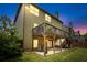 A charming home featuring a patio, a deck and lush green landscaping at 1645 Horseshoe Creek Ln, Cumming, GA 30041