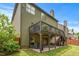 A charming home featuring a patio, a deck and lush green landscaping at 1645 Horseshoe Creek Ln, Cumming, GA 30041