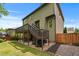 A charming home featuring a patio, a deck and lush green landscaping at 1645 Horseshoe Creek Ln, Cumming, GA 30041