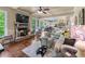 Spacious living room with fireplace, hardwood floors, coffered ceiling, and open concept design at 1645 Horseshoe Creek Ln, Cumming, GA 30041