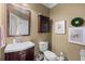 Stylish powder room with elegant mirror, sink, and fixtures, complemented by tasteful decor at 1645 Horseshoe Creek Ln, Cumming, GA 30041