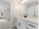 Bright bathroom featuring white cabinets, quartz countertops, and modern fixtures at 2722 Byess Ct, Marietta, GA 30064