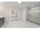 Bathroom with white marble tile floors, a glass shower and access to the main bedroom at 2722 Byess Ct, Marietta, GA 30064