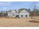 Charming two-story home featuring gray siding, brick accents, and a well-manicured lawn, perfect for curb appeal at 2722 Byess Ct, Marietta, GA 30064