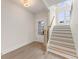 Inviting foyer with hardwood floors, staircase with decorative black iron spindles, and bright natural light at 2722 Byess Ct, Marietta, GA 30064