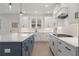 Modern kitchen with an island, white cabinets, stone countertops, and stainless appliances at 2722 Byess Ct, Marietta, GA 30064
