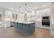 Bright eat-in kitchen featuring a large central island, white cabinets, stainless steel appliances, and granite countertops at 2722 Byess Ct, Marietta, GA 30064