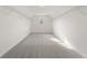 Large, empty walk-in closet with carpet and hanging shelves and natural light at 2722 Byess Ct, Marietta, GA 30064