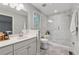 Contemporary bathroom featuring a glass-enclosed shower, a sleek vanity, and modern fixtures at 2986 Edenberry Nw Ln, Kennesaw, GA 30152