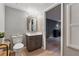 Stylish powder room showcasing a modern vanity, designer fixtures, and wood flooring at 2986 Edenberry Nw Ln, Kennesaw, GA 30152