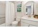 Charming bathroom with stylish wallpaper, shower curtain, and vanity at 2986 Edenberry Nw Ln, Kennesaw, GA 30152