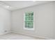 Bright bedroom with neutral carpet and large window at 2986 Edenberry Nw Ln, Kennesaw, GA 30152