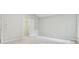 Bright bedroom featuring soft carpeting, neutral walls, and a walk-in closet, creating a cozy retreat at 2986 Edenberry Nw Ln, Kennesaw, GA 30152