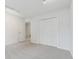 Spacious bedroom featuring neutral carpet, accent wall and closet at 2986 Edenberry Nw Ln, Kennesaw, GA 30152
