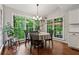 Cozy breakfast nook with views of the wooded backyard, perfect for casual dining at 2986 Edenberry Nw Ln, Kennesaw, GA 30152