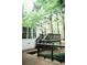 Wood deck with black railings off of a white home surrounded by mature trees at 2986 Edenberry Nw Ln, Kennesaw, GA 30152