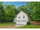Stunning two-story house surrounded by lush greenery, complemented by a well-manicured lawn at 2986 Edenberry Nw Ln, Kennesaw, GA 30152