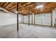 Unfinished two-car garage with concrete floor, overhead lighting and exposed insulation at 2986 Edenberry Nw Ln, Kennesaw, GA 30152