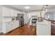 Well-lit kitchen features white cabinets, stainless steel appliances, and hardwood floors at 2986 Edenberry Nw Ln, Kennesaw, GA 30152