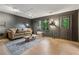 Comfortable living room with hardwood floors, stylish decor, and large windows providing natural light at 2986 Edenberry Nw Ln, Kennesaw, GA 30152