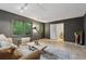 Comfortable living room with stylish decor, large windows, and hardwood floors at 2986 Edenberry Nw Ln, Kennesaw, GA 30152