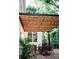 Outdoor patio with dining set with a wood pergola overhead with string lights at 2986 Edenberry Nw Ln, Kennesaw, GA 30152