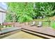 This large deck area has lounge chairs, a porch swing and an inground hot tub at 3168 Kirkwood Nw Dr, Kennesaw, GA 30144