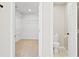 Bathroom with a toilet and a walk-in closet with wire shelving for storage at 3168 Kirkwood Nw Dr, Kennesaw, GA 30144