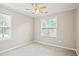 Bedroom featuring carpet, windows, and a ceiling fan at 3168 Kirkwood Nw Dr, Kennesaw, GA 30144