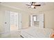 Bedroom showing tray ceiling with fan, bedroom furniture and double doors to closet and bathroom at 3168 Kirkwood Nw Dr, Kennesaw, GA 30144