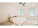 Bedroom features a tray ceiling with fan, two windows, neutral walls, and a queen-sized bed at 3168 Kirkwood Nw Dr, Kennesaw, GA 30144