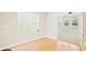 Bright breakfast nook features hardwood flooring, white walls, and lots of natural light at 3168 Kirkwood Nw Dr, Kennesaw, GA 30144