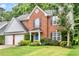 Attractive brick home with blue shutters and a well-maintained lawn at 3168 Kirkwood Nw Dr, Kennesaw, GA 30144